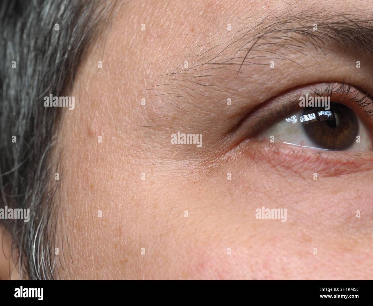 Détail de l'œil homme jeune adulte Banque D'Images