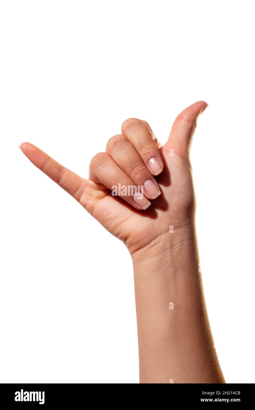 Langue des signes, la lettre Y. isolé sur fond blanc.Main de la femme avec le geste de la lettre y dans l'alphabet de signe. Banque D'Images