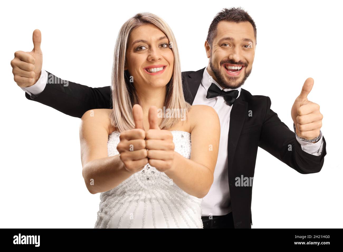 Mariée et marié joyeux montrant les pouces isolés sur fond blanc Banque D'Images