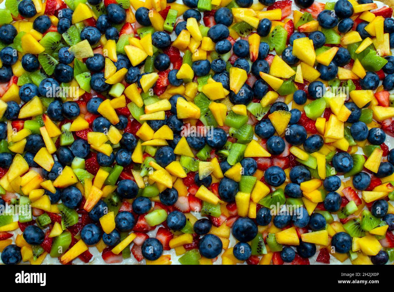 Ce joli fond de fruit coloré et lumineux saura taquiner les sens et taquiner les papilles qui font l'eau de la bouche. Banque D'Images