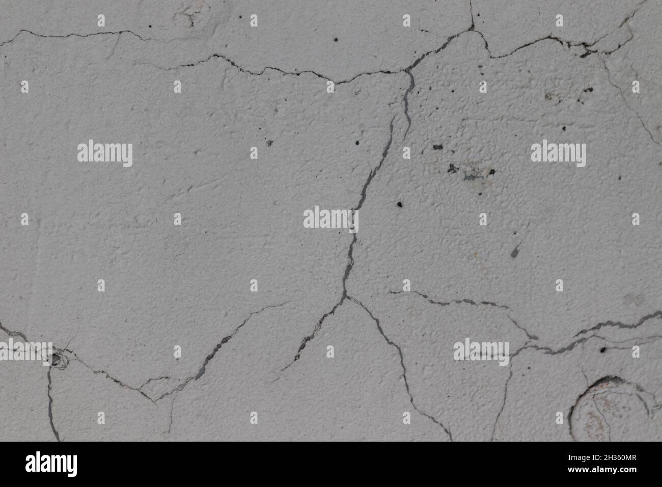 Mur en béton fissuré.Texture craquelée. Banque D'Images