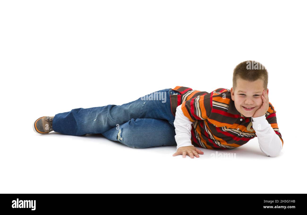 Boy lying on floor Banque D'Images