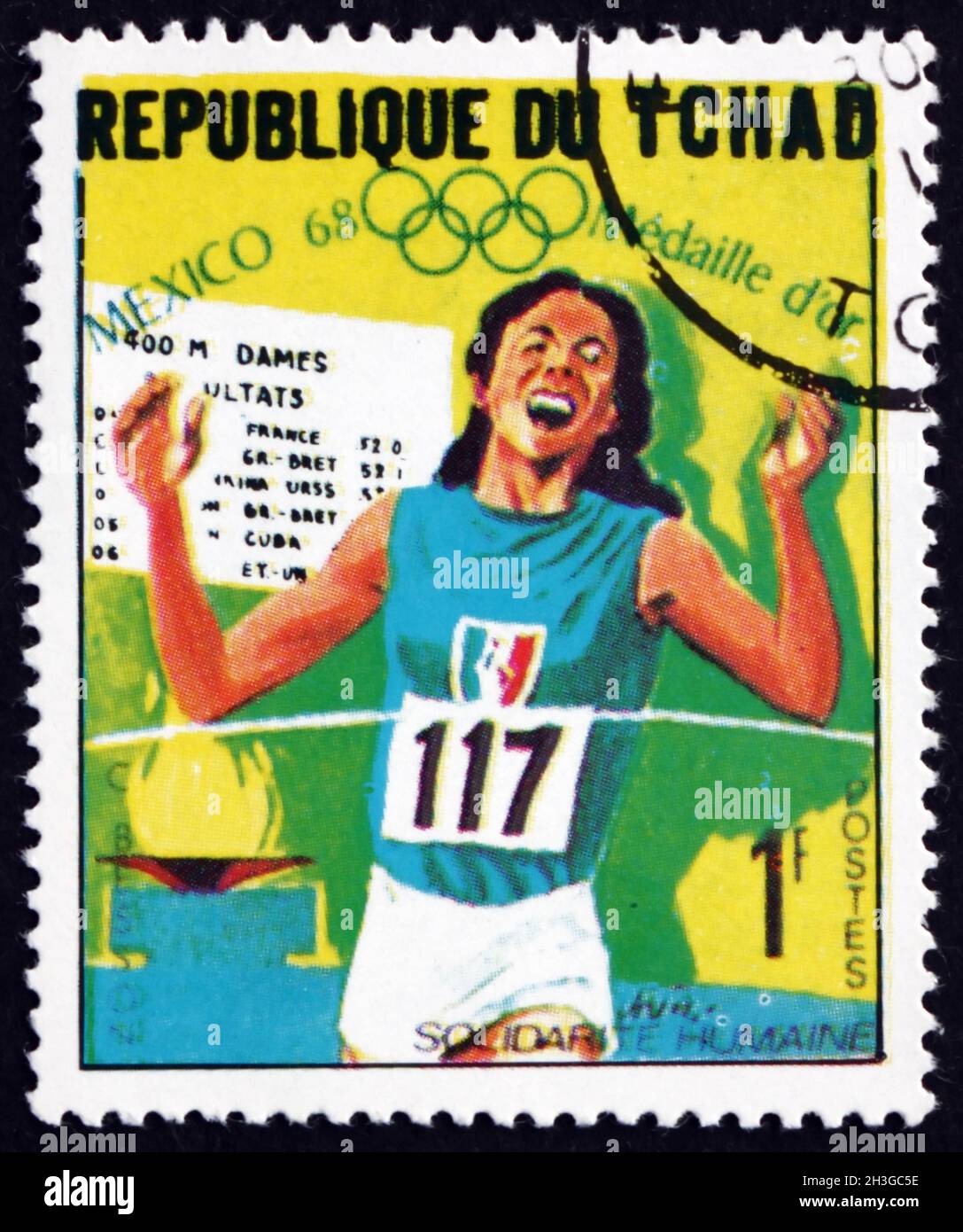 TCHAD - VERS 1969 : un timbre imprimé au Tchad montre Colette Besson, course de 400m, gagnante des Jeux Olympiques de 1968, Mexique, vers 1969 Banque D'Images