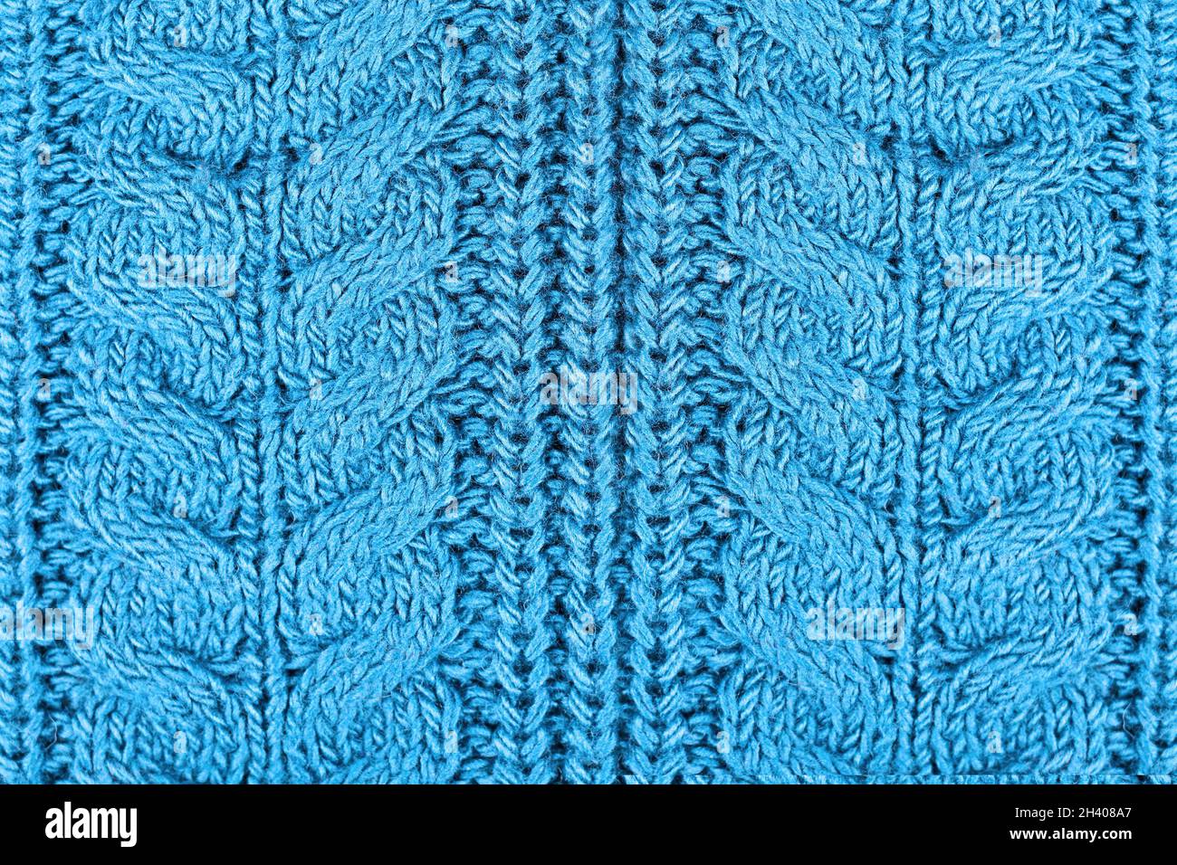 Gros plan sur le pull en laine bleue à motif tricoté Banque D'Images