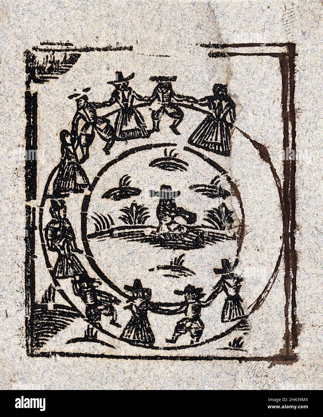 Un cercle de sorcières dansent autour d'une figure centrale.Coupe de bois, env.1700-1720. Banque D'Images