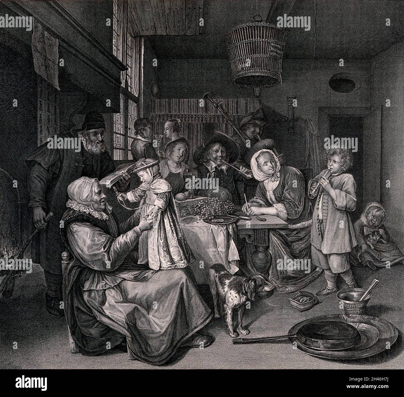 Un groupe familial s'est réuni autour d'une table de chant au coin du feu et jouant des instruments de musique.Gravure par Villain après Duchemin après Jan Steen. Banque D'Images