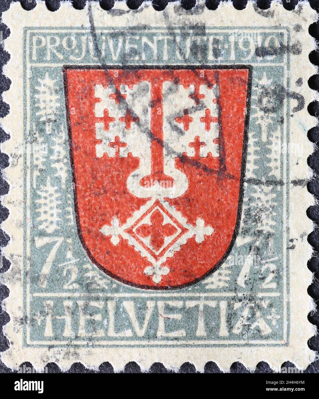 Suisse - Circa 1919: Timbre-poste imprimé en Suisse avec une double clé sur les armoiries du canton suisse de Nidwalden sur un ch Banque D'Images