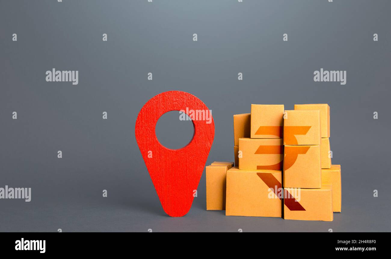Boîtes avec symbole roupie indienne et broche de positionnement rouge.Logistique de livraison de transport, gestion d'entrepôt.Commerce de marchandises.Fabricant national. Banque D'Images