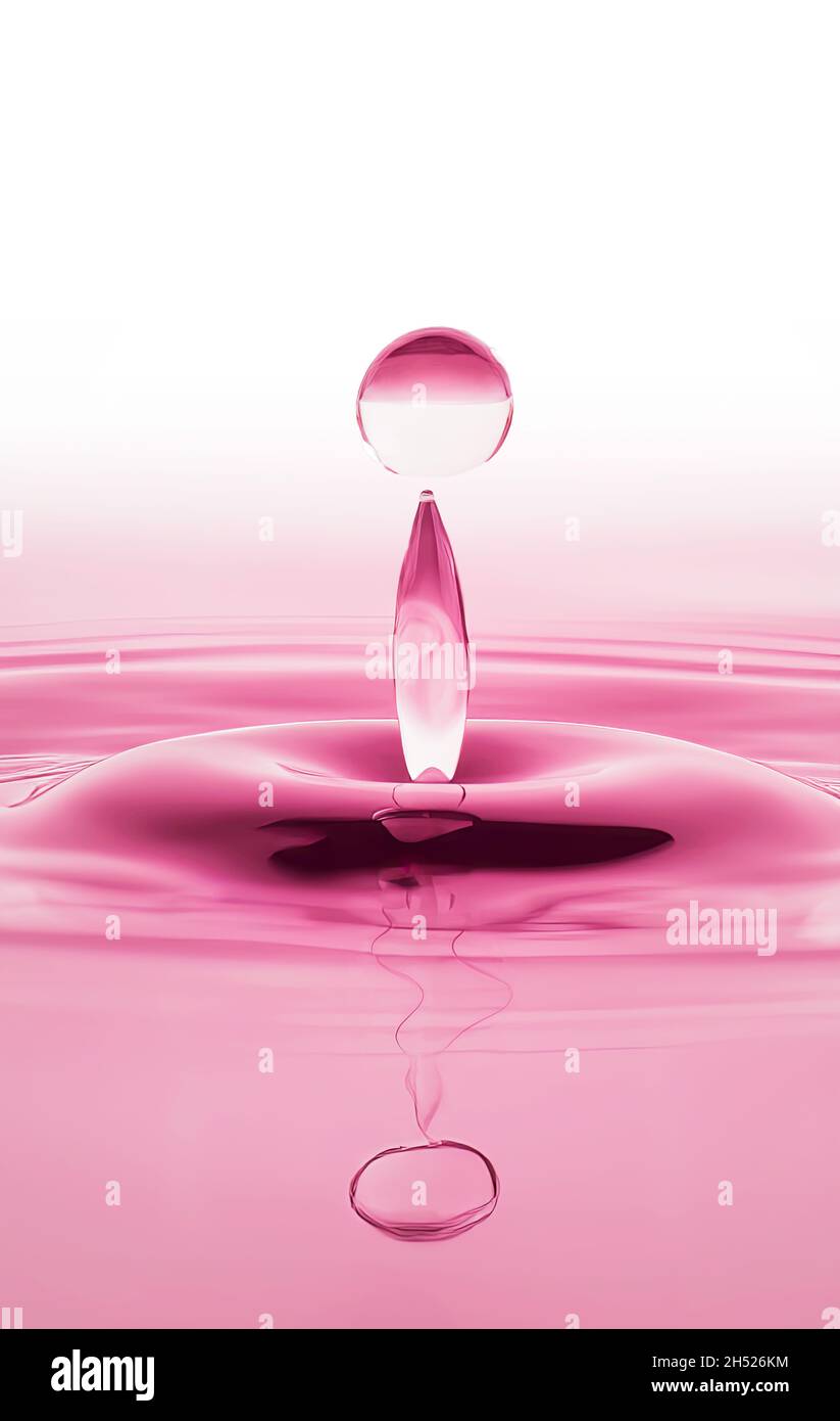 Chute tombant sur la surface de l'eau dans des tons de lumière rose Banque D'Images