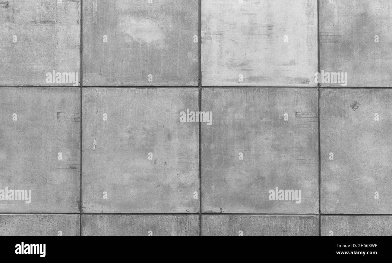 Mur en béton gris avec beaucoup de formes en béton et de lignes de grille Banque D'Images