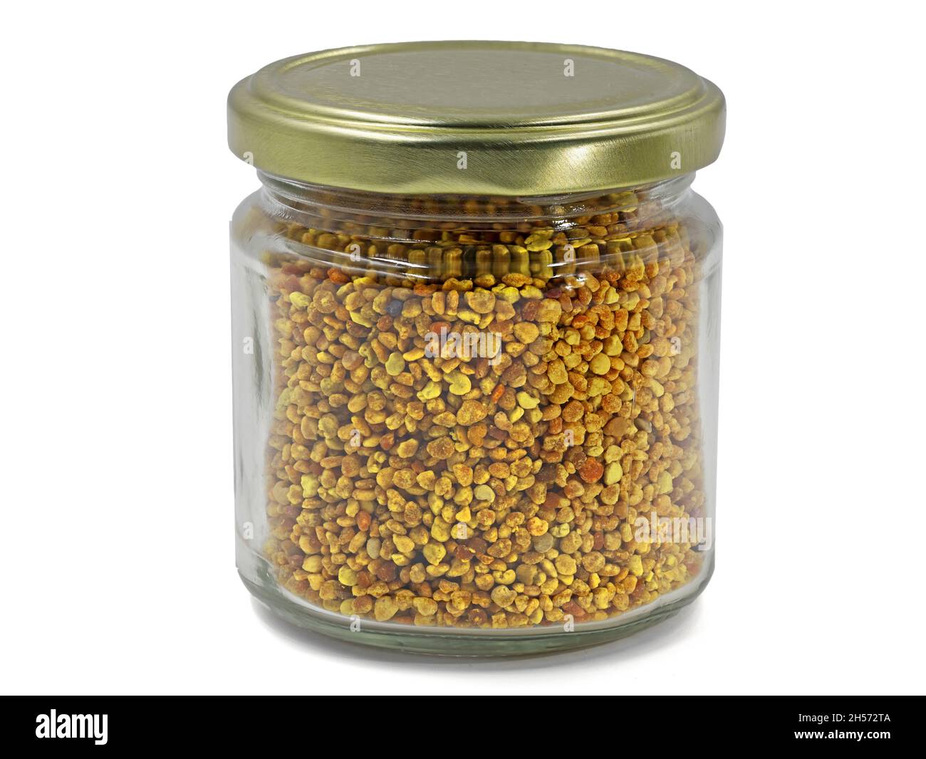 Pollen de fleur d'abeille dans un pot de verre isolé sur fond blanc Banque D'Images