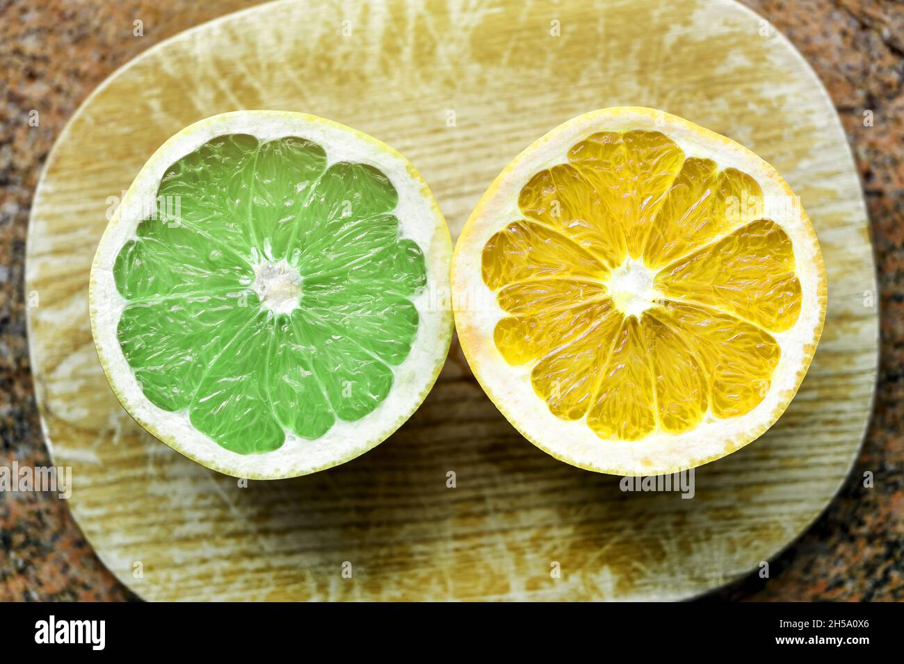 FotoMONTAGE, Grüne und gelbe Zitrusfrucht, Symbolfoto Zitrus-Koïdte von Grüne und FDP Banque D'Images
