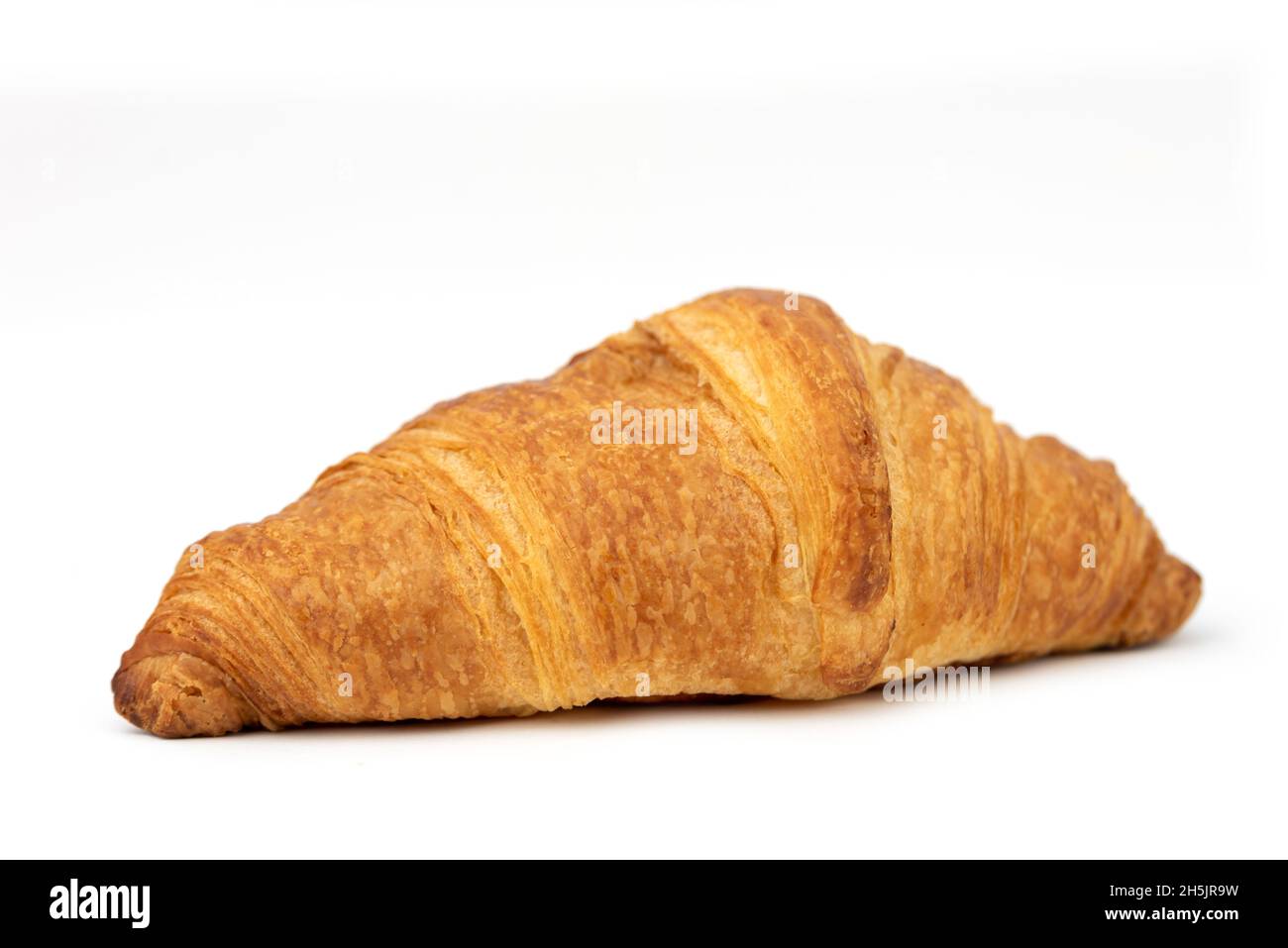 Le croissant français frais isolé dans le noir blanc Banque D'Images