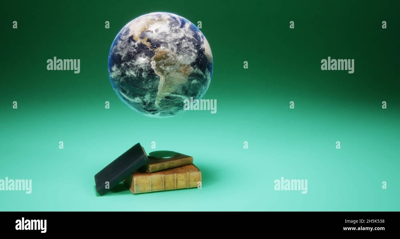 Globe sur un support magnétique et de vieux livres Banque D'Images