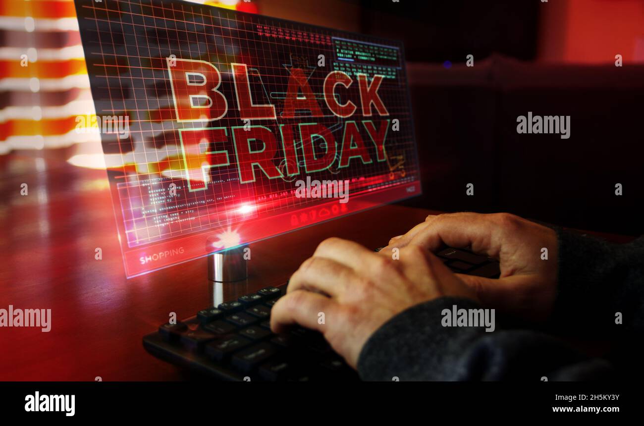 Vendredi noir sur l'écran de l'ordinateur.Grande vente, offre spéciale, shopping et offre spéciale concept 3d abstrait avec effet de glitch.Homme tapant le clavier. Banque D'Images