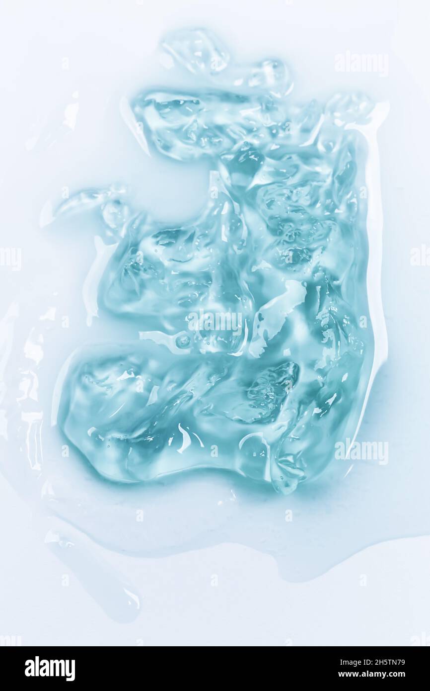 Fond en gel de lotion cosmétique.Concept cosmétique.Gel liquide cosmétique taches texture.Style plat, vue de dessus. Banque D'Images