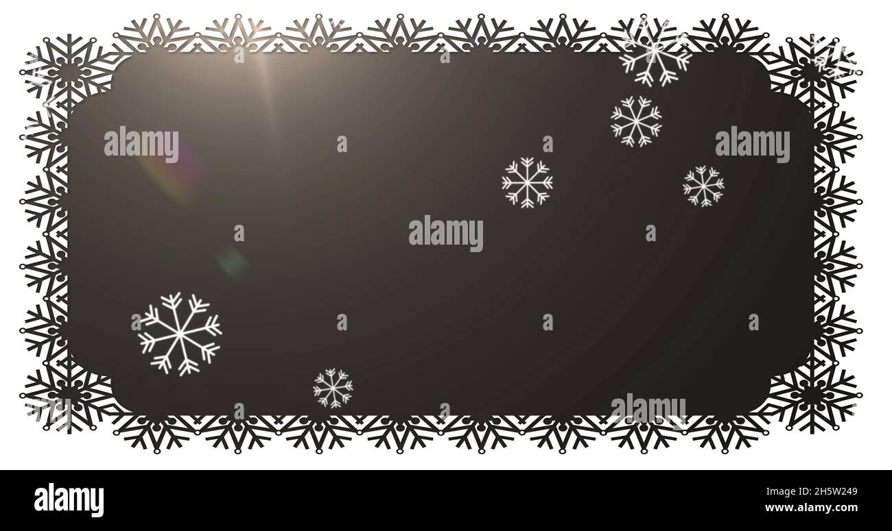 Image de neige tombant à noël sur fond noir Banque D'Images