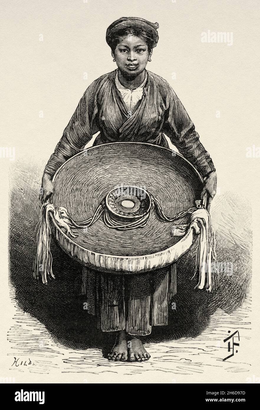 Hanoi femme et à l'intérieur d'un chapeau Tonkinese, Vietnam.Asie.Illustration gravée du XIXe Siècle Une campagne à Tonkin de Charles Edouard Hocquard du Tour du monde 1889 Banque D'Images
