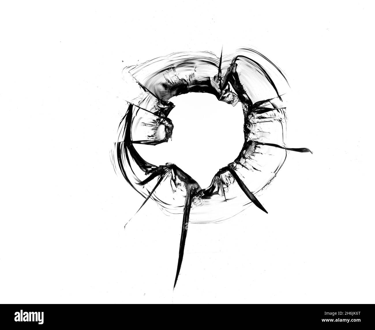 Trou d'une boule dans la vitre sur un fond blanc gros plan. Banque D'Images