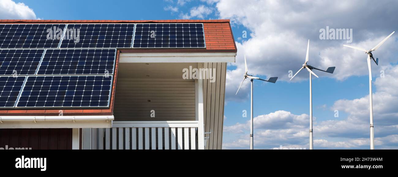 Éco-maison utilisant l'énergie solaire et éolienne Banque D'Images