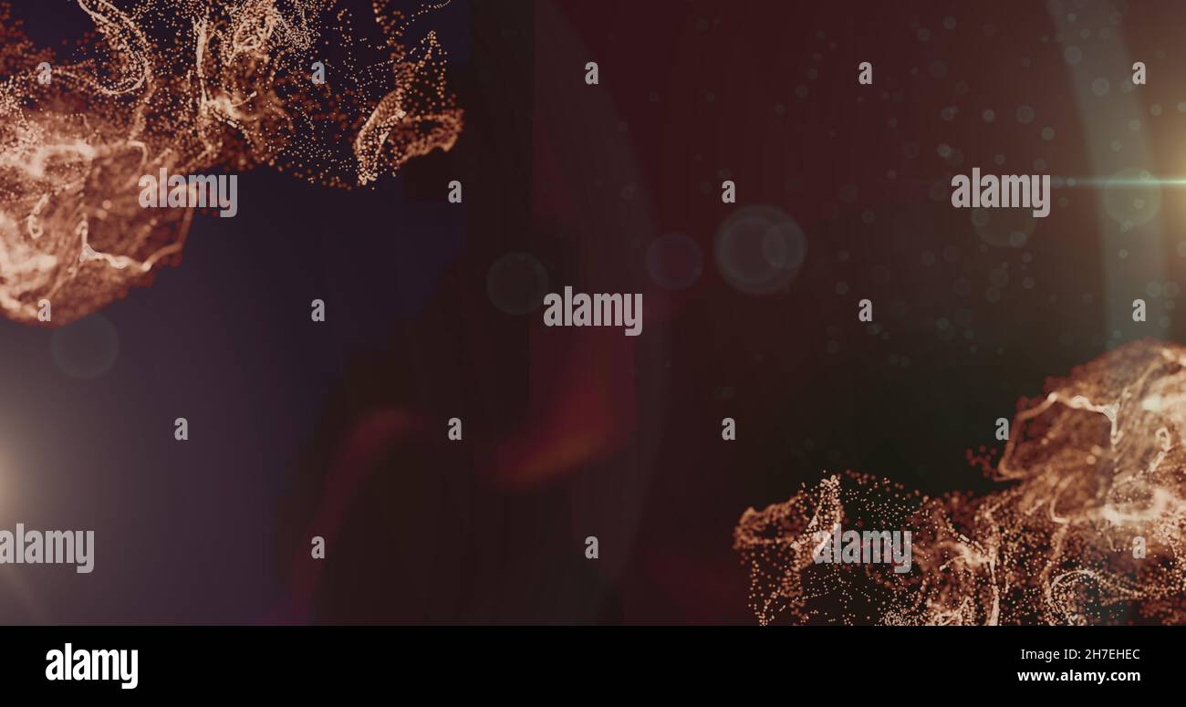 Image des particules orange et des lumières de bokeh se déplaçant sur un arrière-plan sombre Banque D'Images