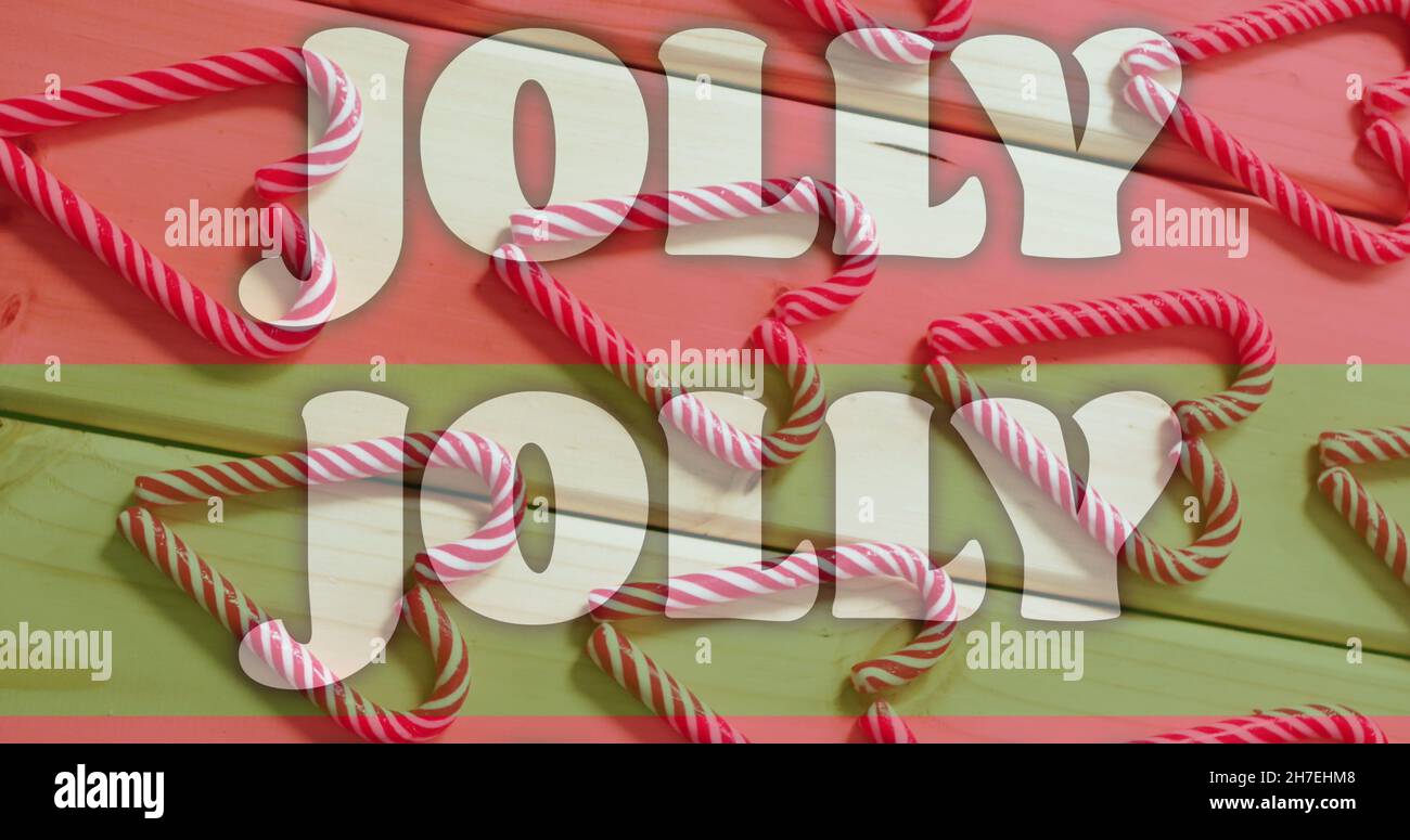 Image de texte de jolly sur des bandes rouges et vertes sur des cannes de noël Banque D'Images