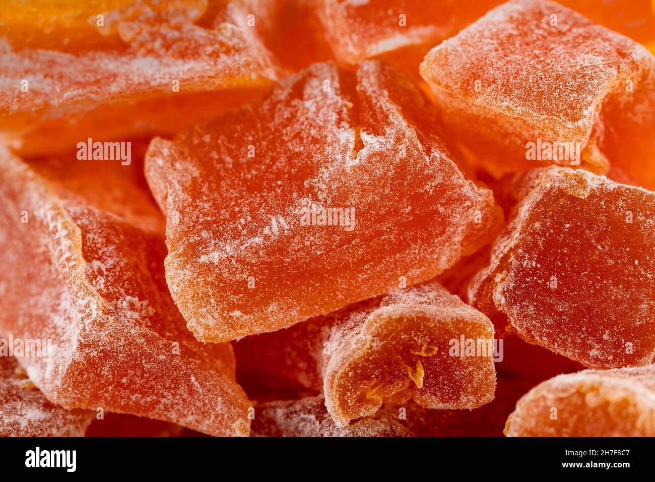 Gros plan de la ferme naturelle fruits de citrouille confits faits maison parsemés de sucre en poudre, fond de nourriture, texture Banque D'Images