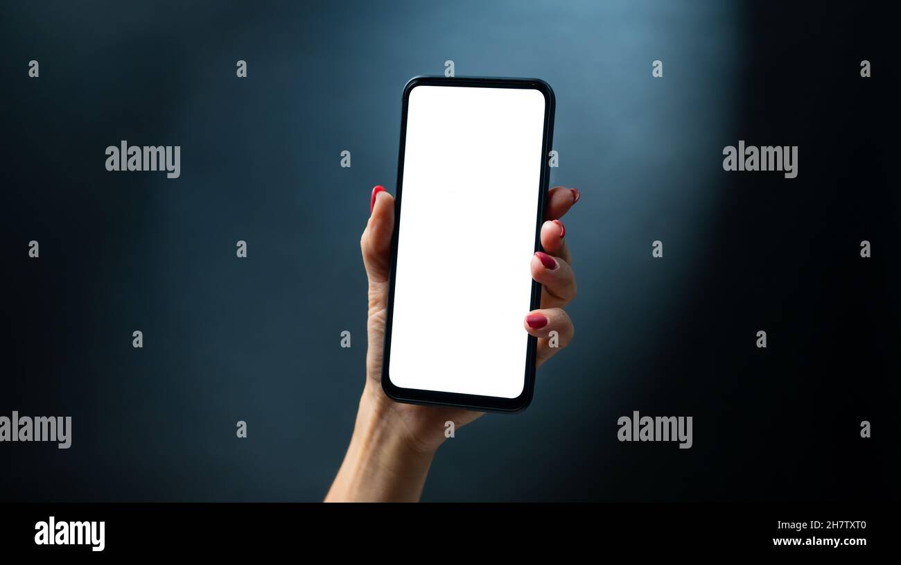 Hand holding smartphone Banque D'Images