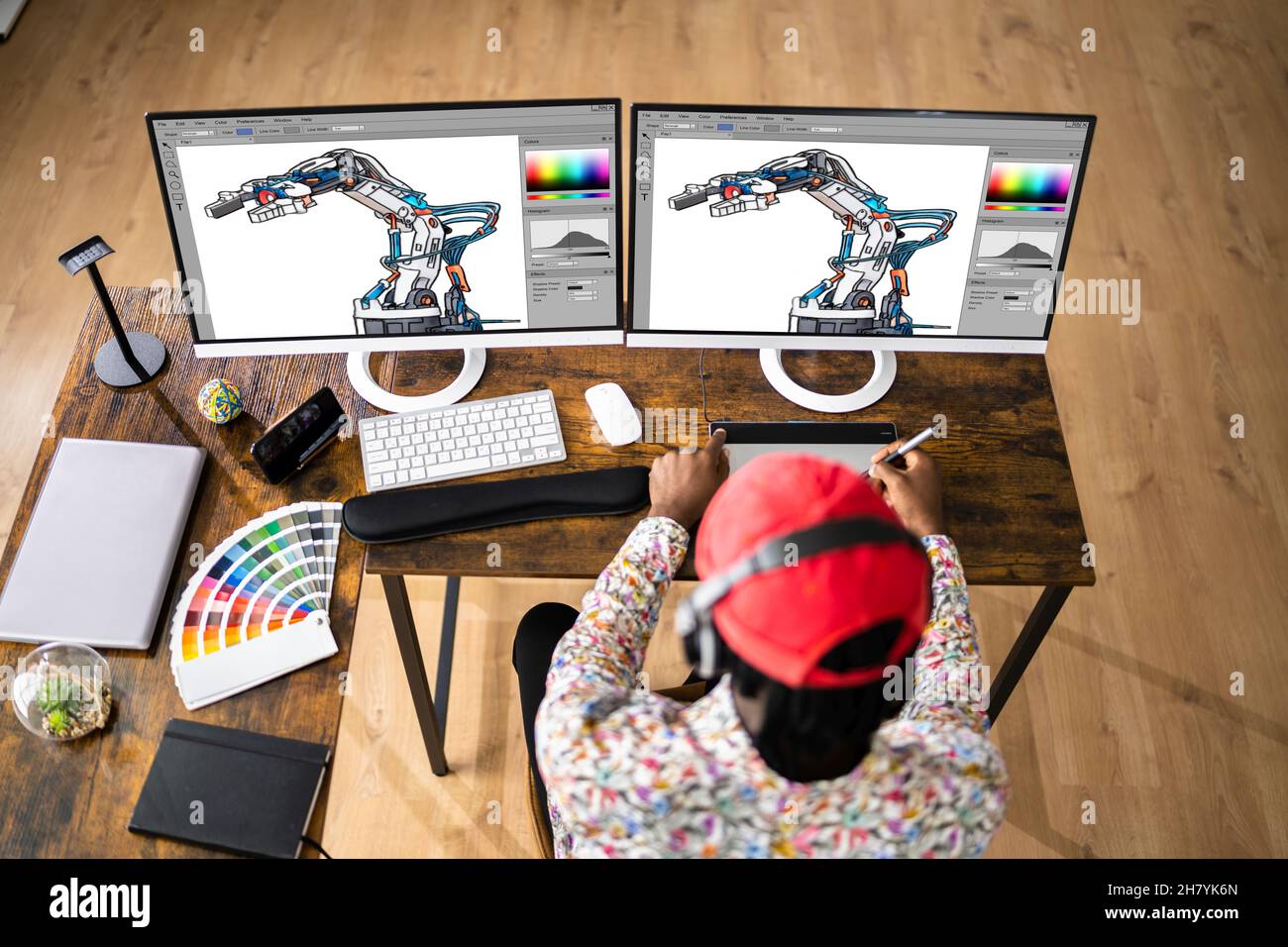 African Graphic Web Designer utilisant le logiciel d'édition de conception Banque D'Images