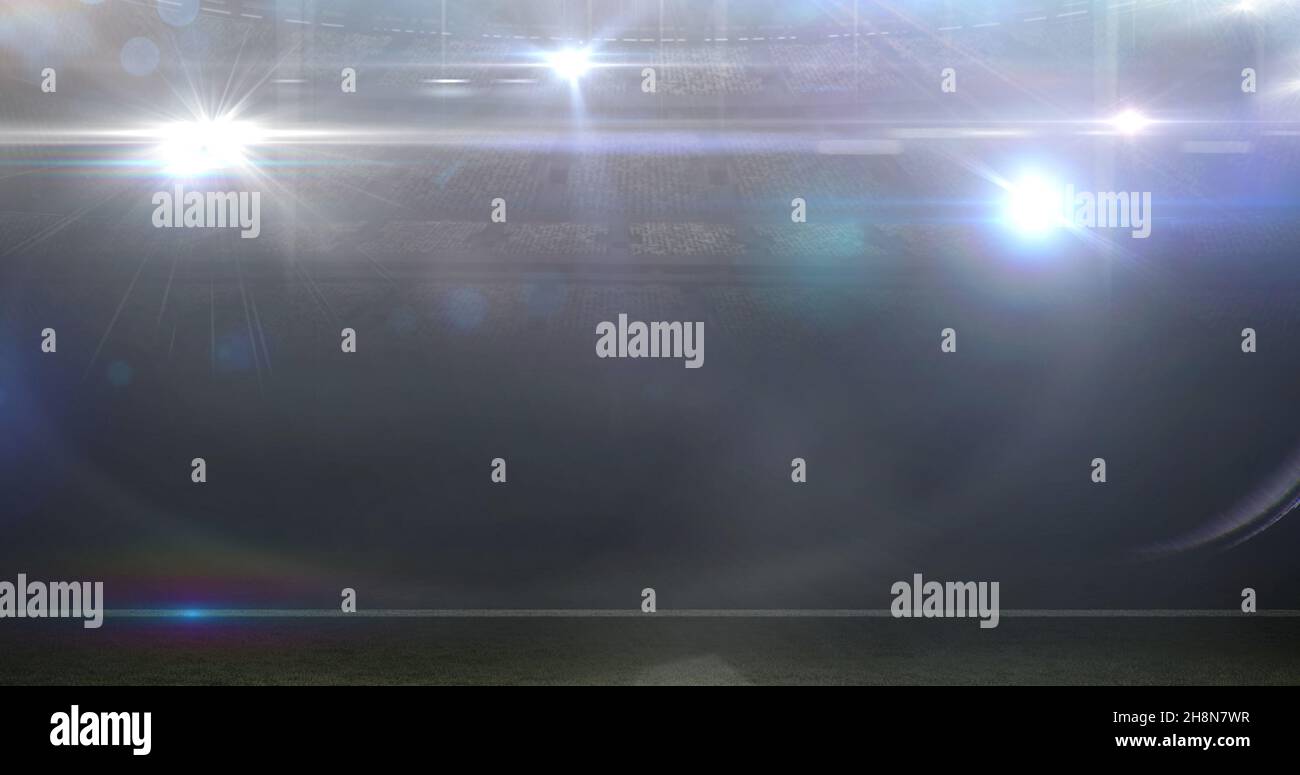 Image numérique composite d'un stade de football américain illuminé avec lumières brillantes Banque D'Images