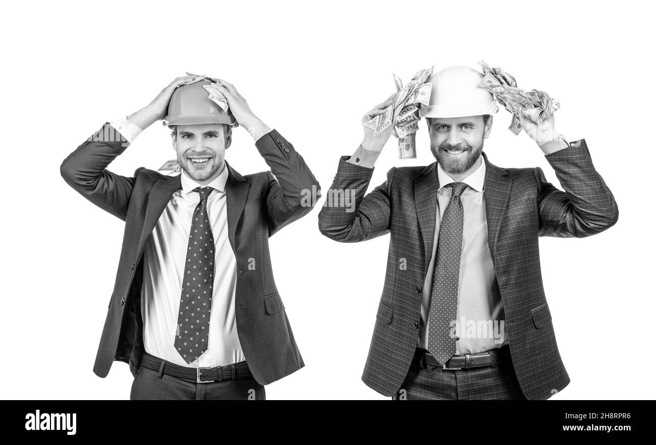 deux hommes d'affaires architecte en casque de protection tiennent dollar facture argent liquide, investissement Banque D'Images