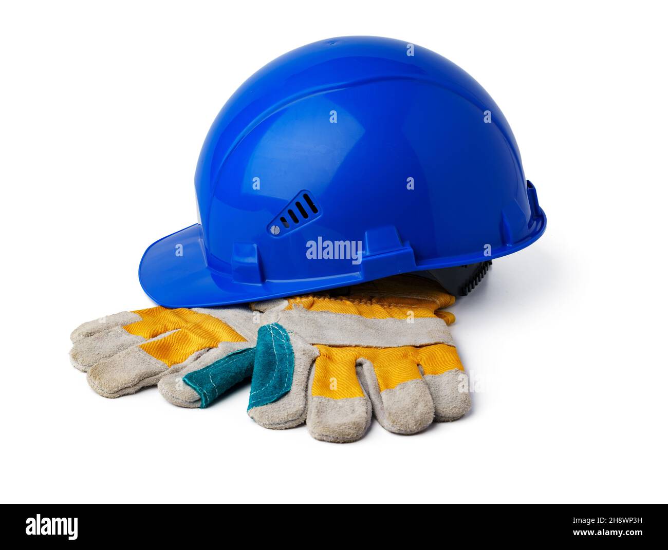 Casque de sécurité et gants de travail isolés sur fond blanc Banque D'Images