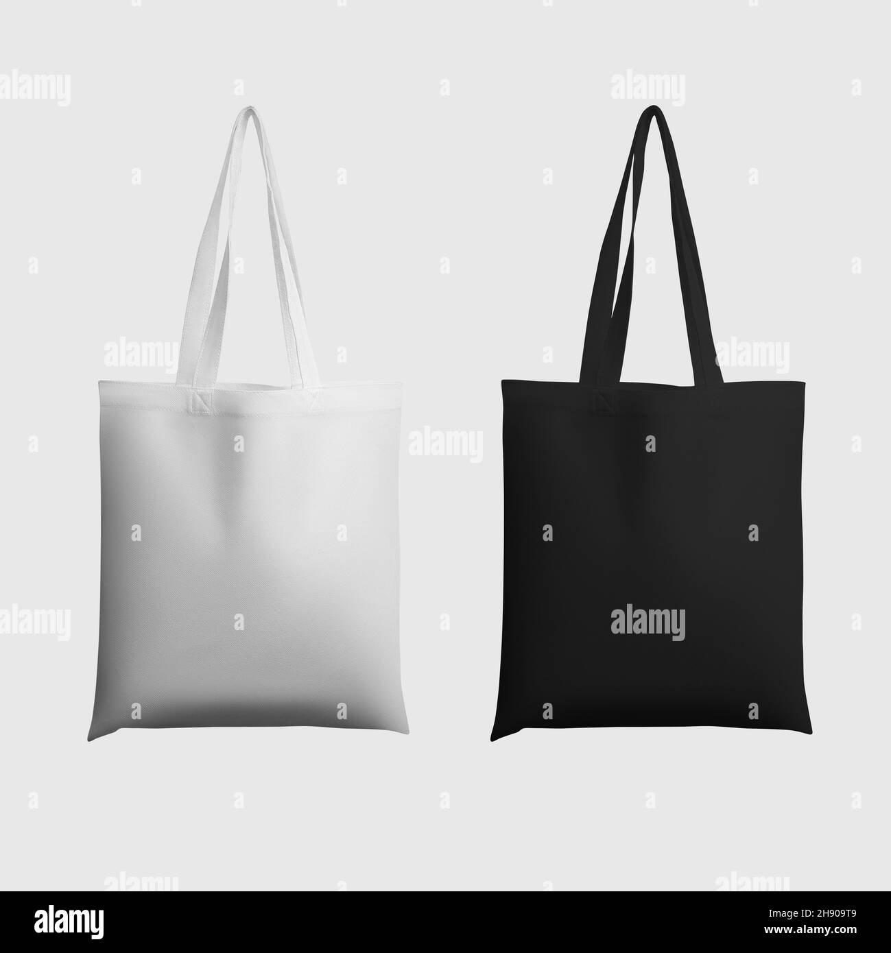 Suspension blanc, noir totebag 3d Rendering template, sac à main écologique avec place pour le design, impression.Maquette d'un écobag tendance isolé en arrière-plan Banque D'Images