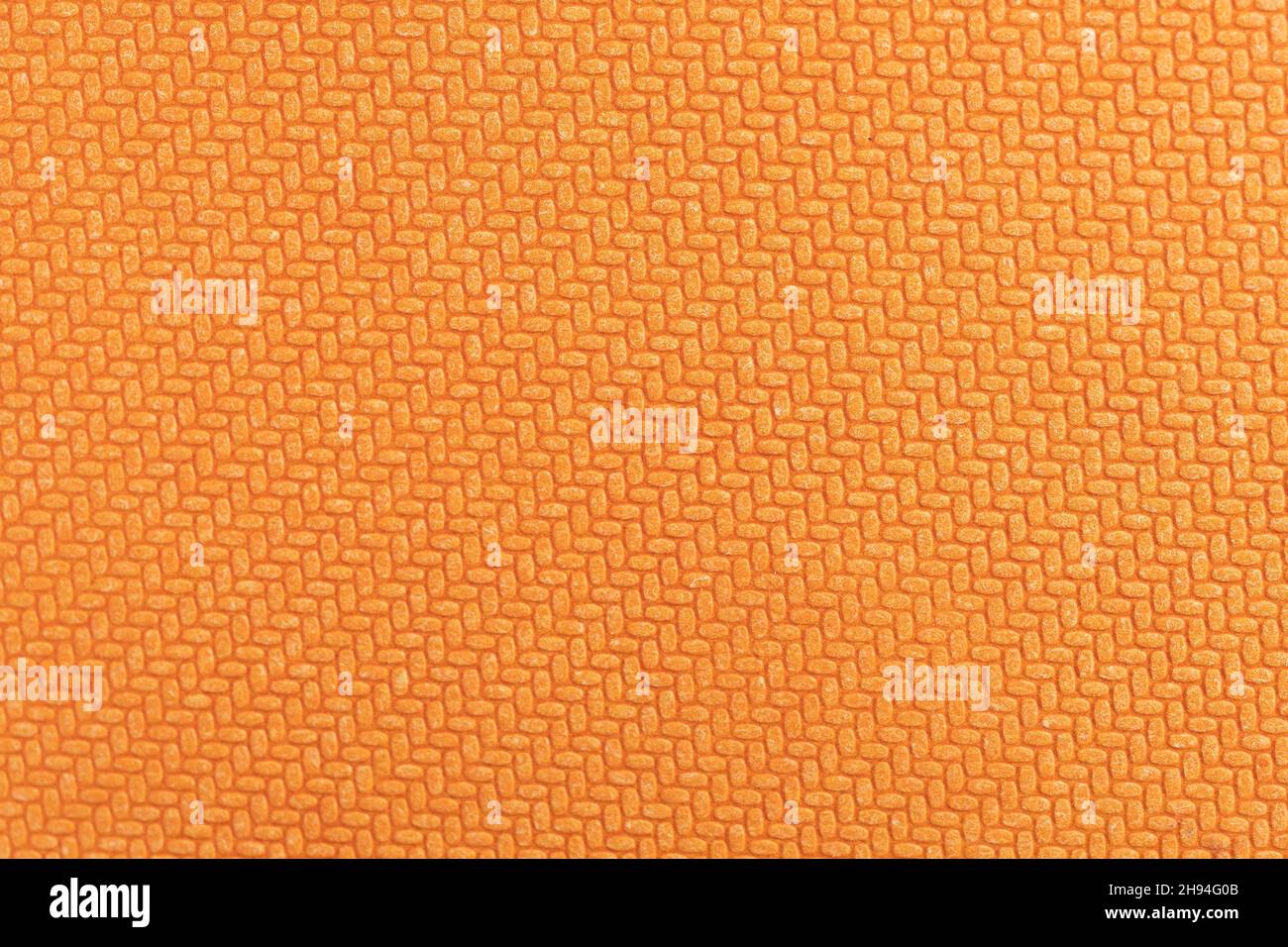 Texture géométrique orange en relief sur carton dur Banque D'Images