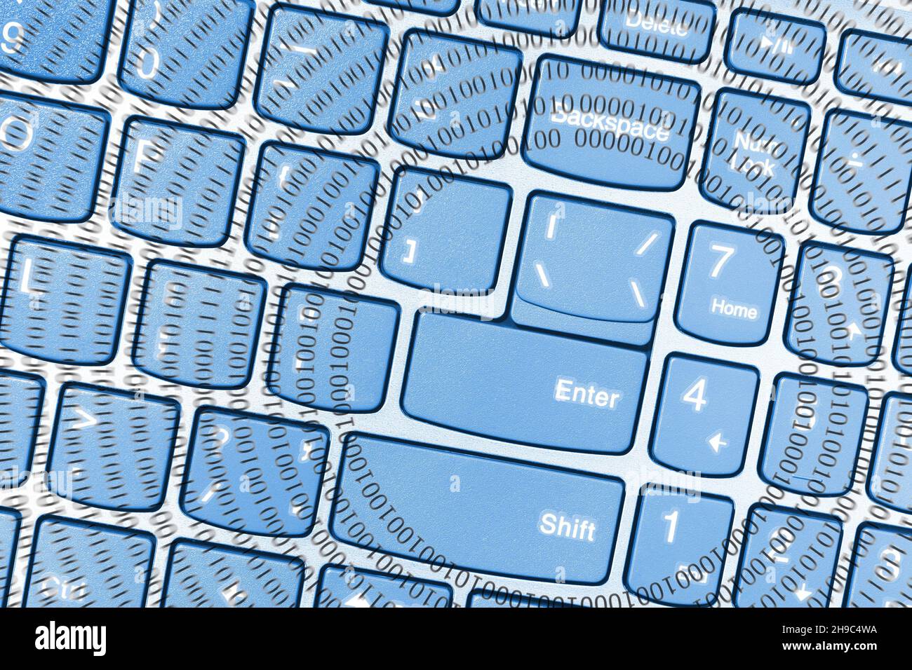 Clavier d'ordinateur portable, vue de dessus avec cercles concentriques formés par un code binaire composé des nombres 1 et 0 Banque D'Images