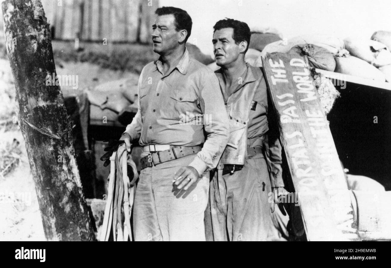 DATE DE SORTIE: 28 août 1951 TITRE: Flying Leathernecks STUDIO: RKO radio Pictures DIRECTEUR: Nicholas Ray PLOT: Le Major Kirby mène l'escadron Wildcats dans la bataille historique de Guadalcanal de la Seconde Guerre mondiale.AVEC : JOHN WAYNE comme major Kirby et ROBERT RYAN comme capitaine Griffin.(Image de crédit : ©RKO radio Pictures/Entertainment Pictures) Banque D'Images