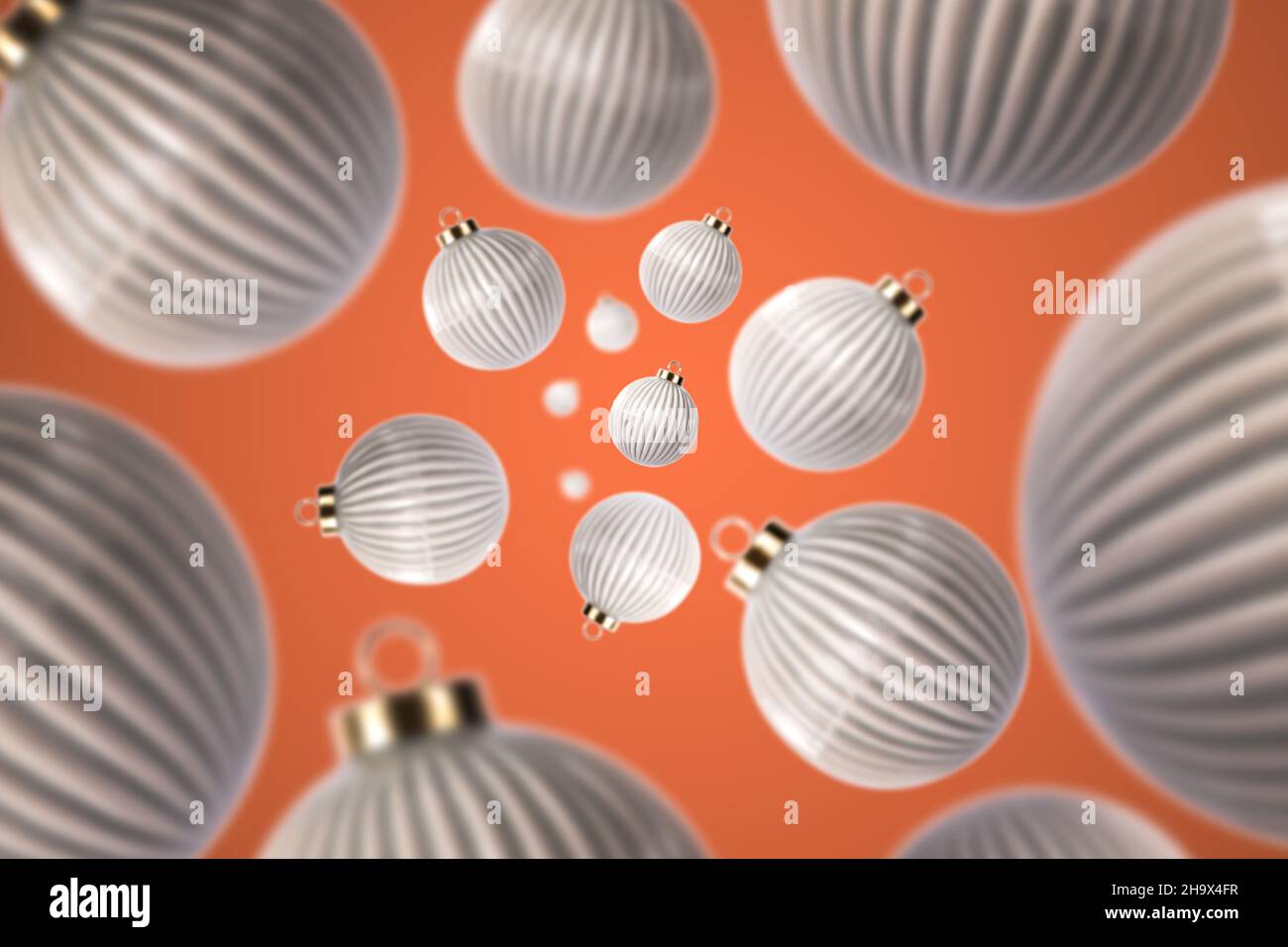 Boules de Noël à côtes abstraites avec fond orange.Décorations d'arbre de Noël sur l'arbre de Noël Banque D'Images