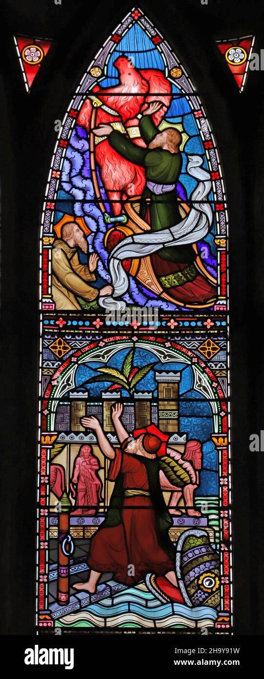 Un vitrail de Frederick Preedy représentant Jonas et la baleine, et Élie pris au ciel dans une église de St Mary tourbillonnante, Old Hunstanton Banque D'Images