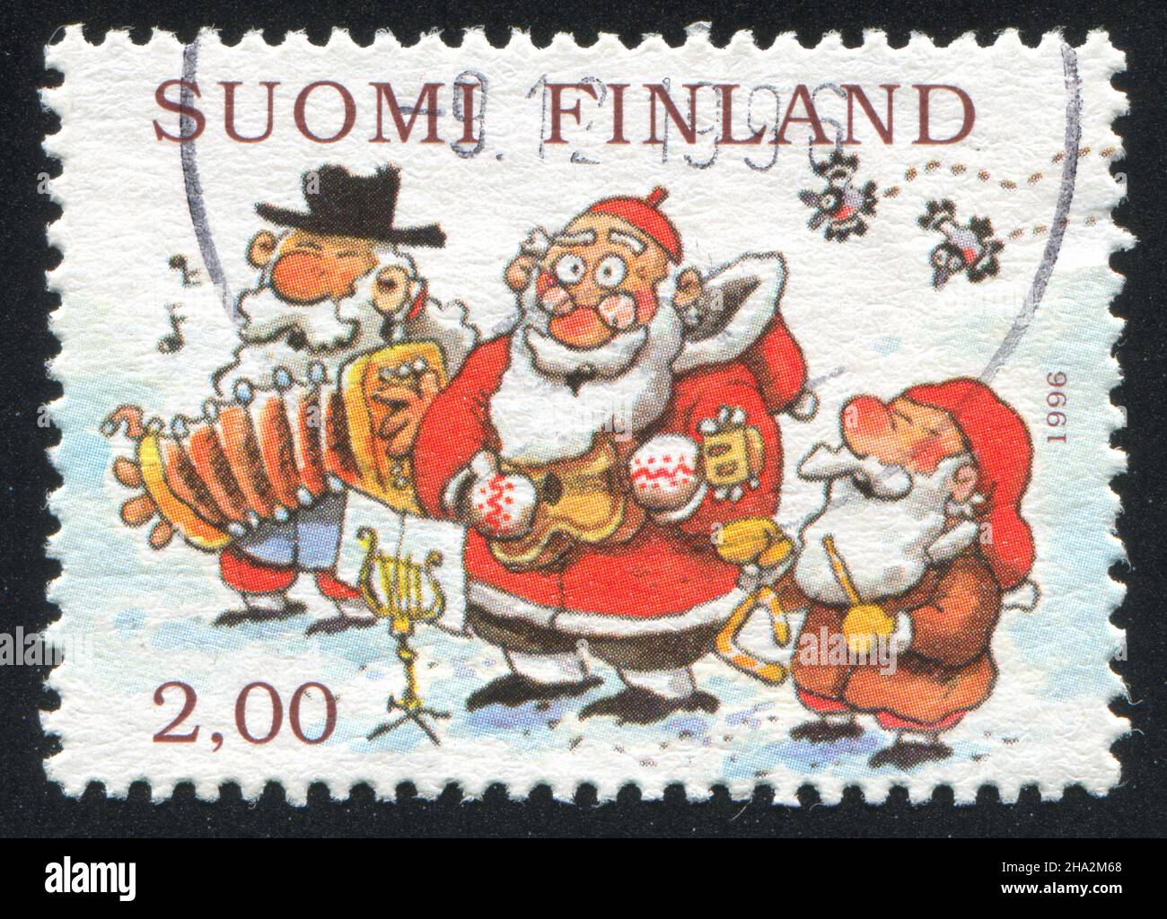 FINLANDE - VERS 1996: Timbre imprimé par la Finlande, montre Snowman, Santa et Gnome jouant des instruments de musique, vers 1996 Banque D'Images