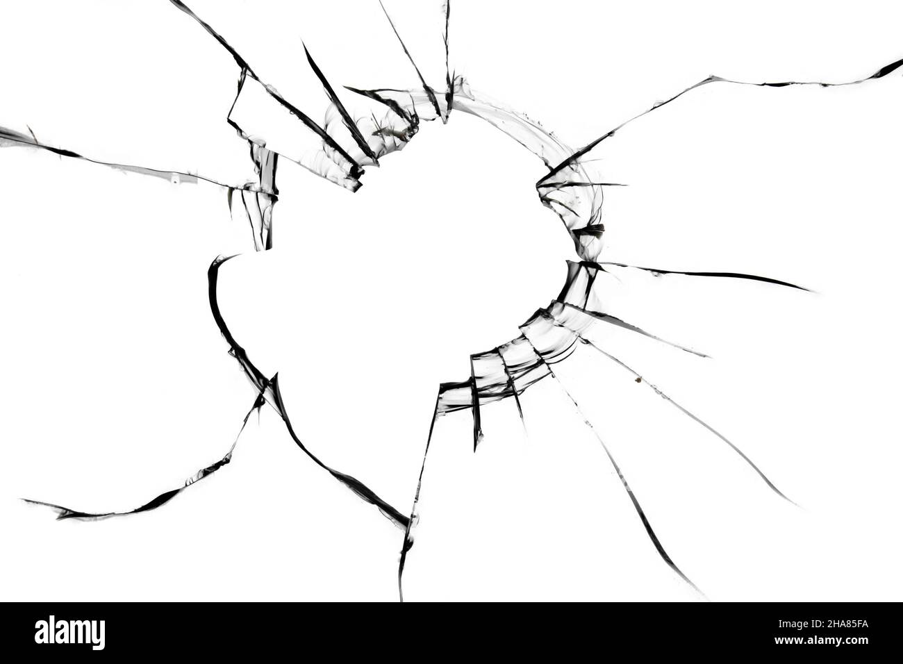 Texture des fissures sur le verre.Un trou dans une fenêtre cassée Banque D'Images