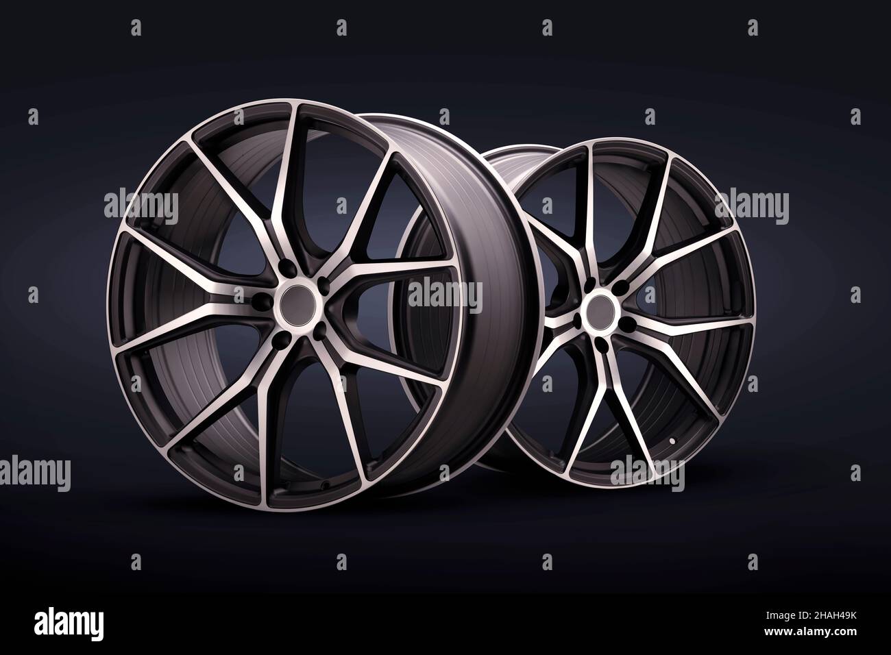 nouvelles roues en alliage forgé sur fond bleu noir. roues sport fraîches avec rayons fins, réglage automatique du poids léger, atelier de pneus ou sport automobile Banque D'Images