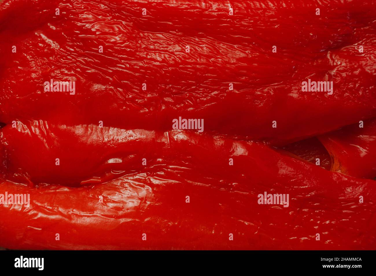 Macro d'une texture de poivron rouge grillé. Banque D'Images
