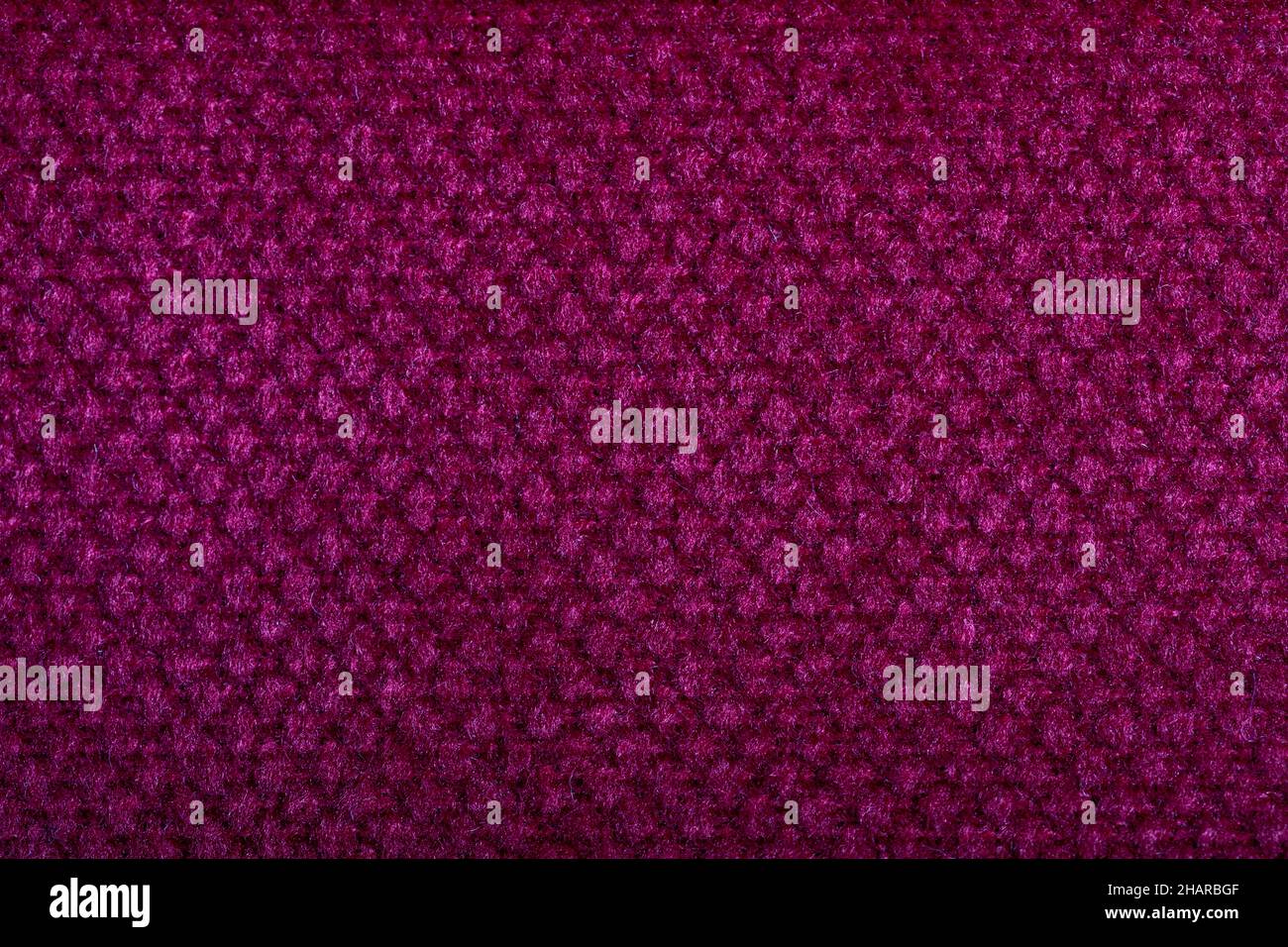 Texture de tissu violet.Tissus d'ameublement.Motif en relief.Fibres tissées.Le matériau est doux au toucher.Concept de minimalisme.Macr. Haut niveau de détail Banque D'Images