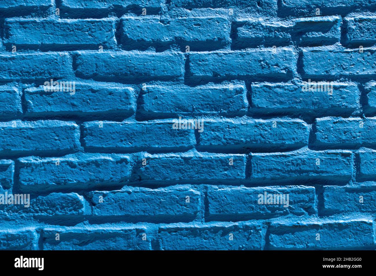 Mur de briques peint en bleu Banque D'Images