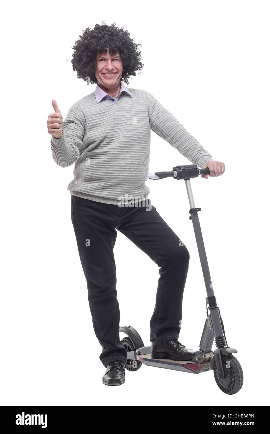 en pleine croissance. homme joyeux avec un scooter électrique. Banque D'Images