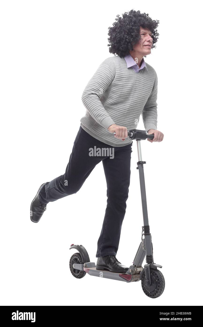 en pleine croissance. homme joyeux avec un scooter électrique. Banque D'Images