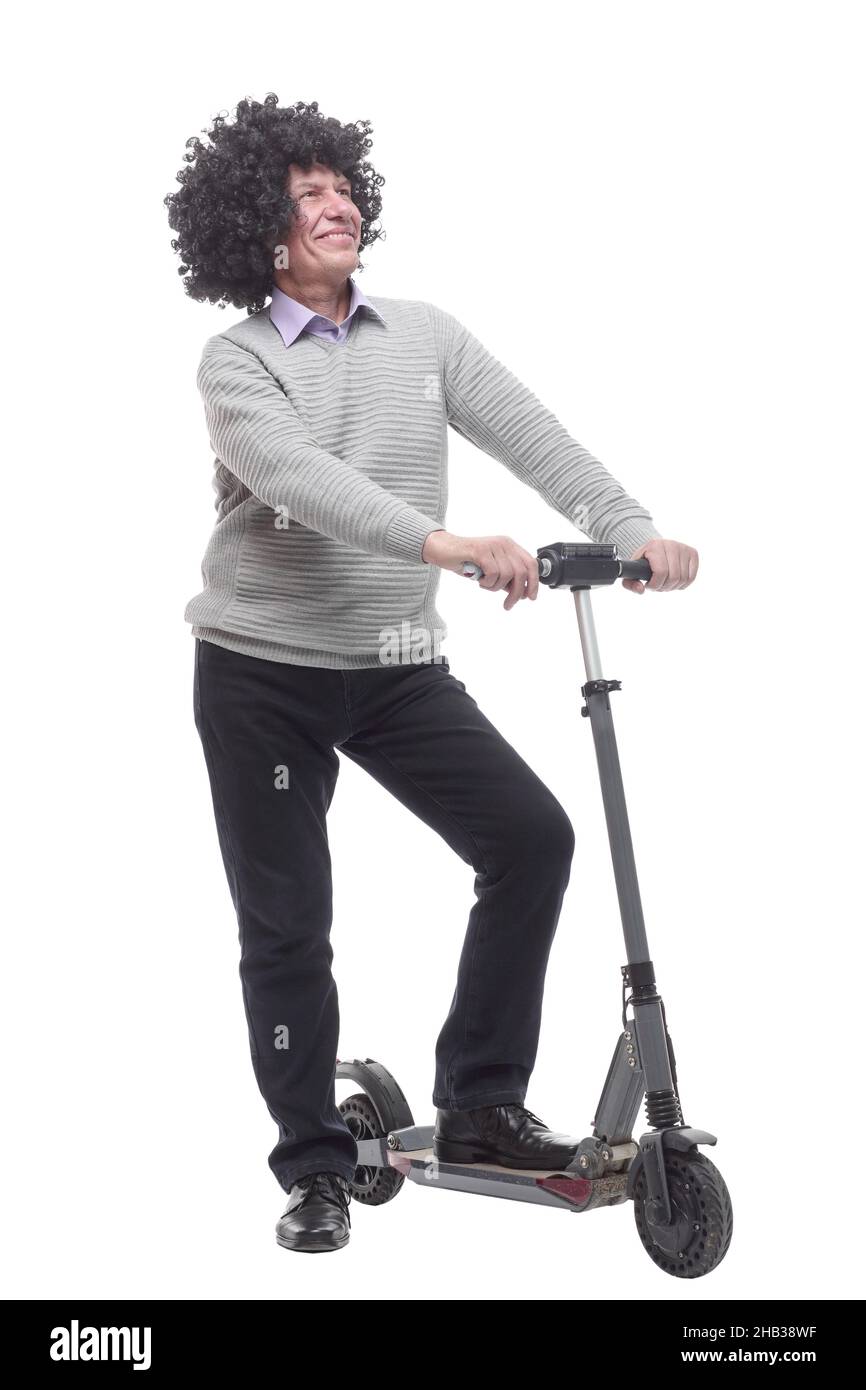 en pleine croissance. homme joyeux avec un scooter électrique. Banque D'Images