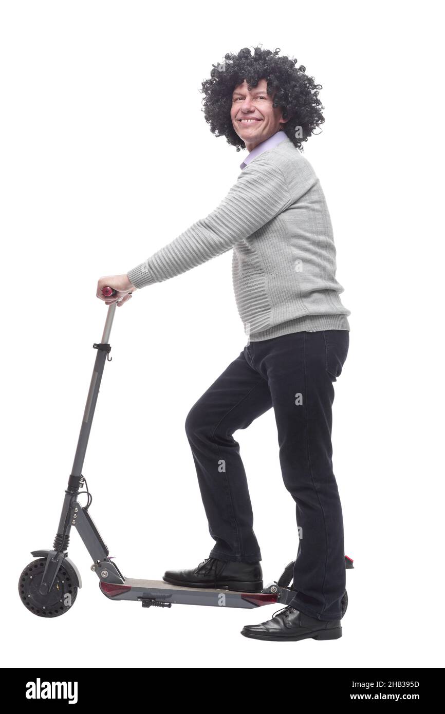 en pleine croissance. homme joyeux avec un scooter électrique. Banque D'Images