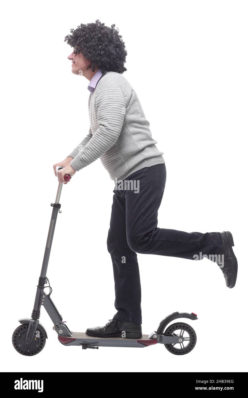 en pleine croissance. homme joyeux avec un scooter électrique. Banque D'Images