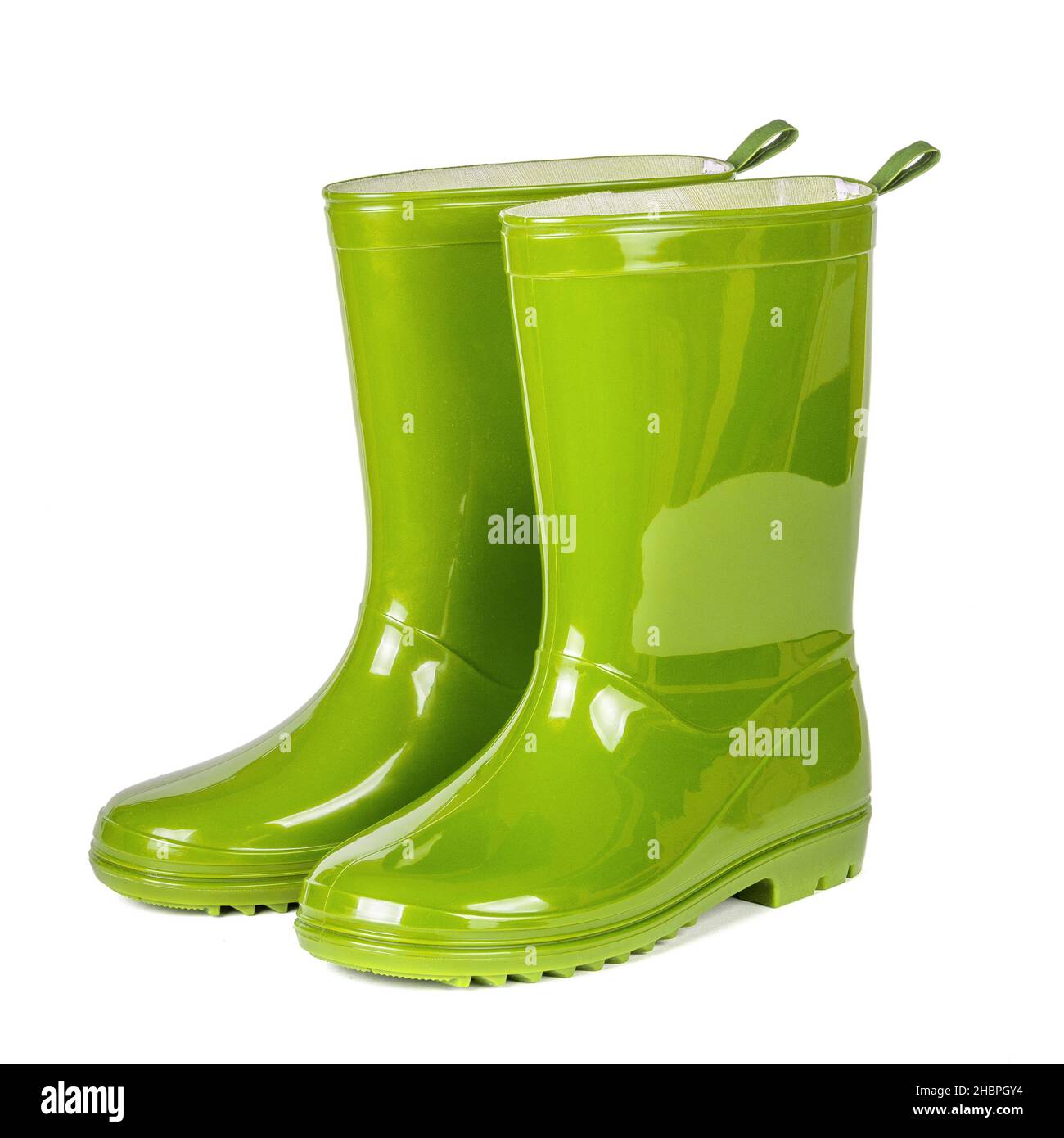 Bottes en caoutchouc vert isolé sur fond blanc. Banque D'Images